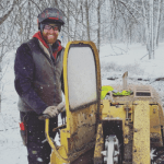 ISA Certified Arborist preparing soil after stump grinding in Milwaukee