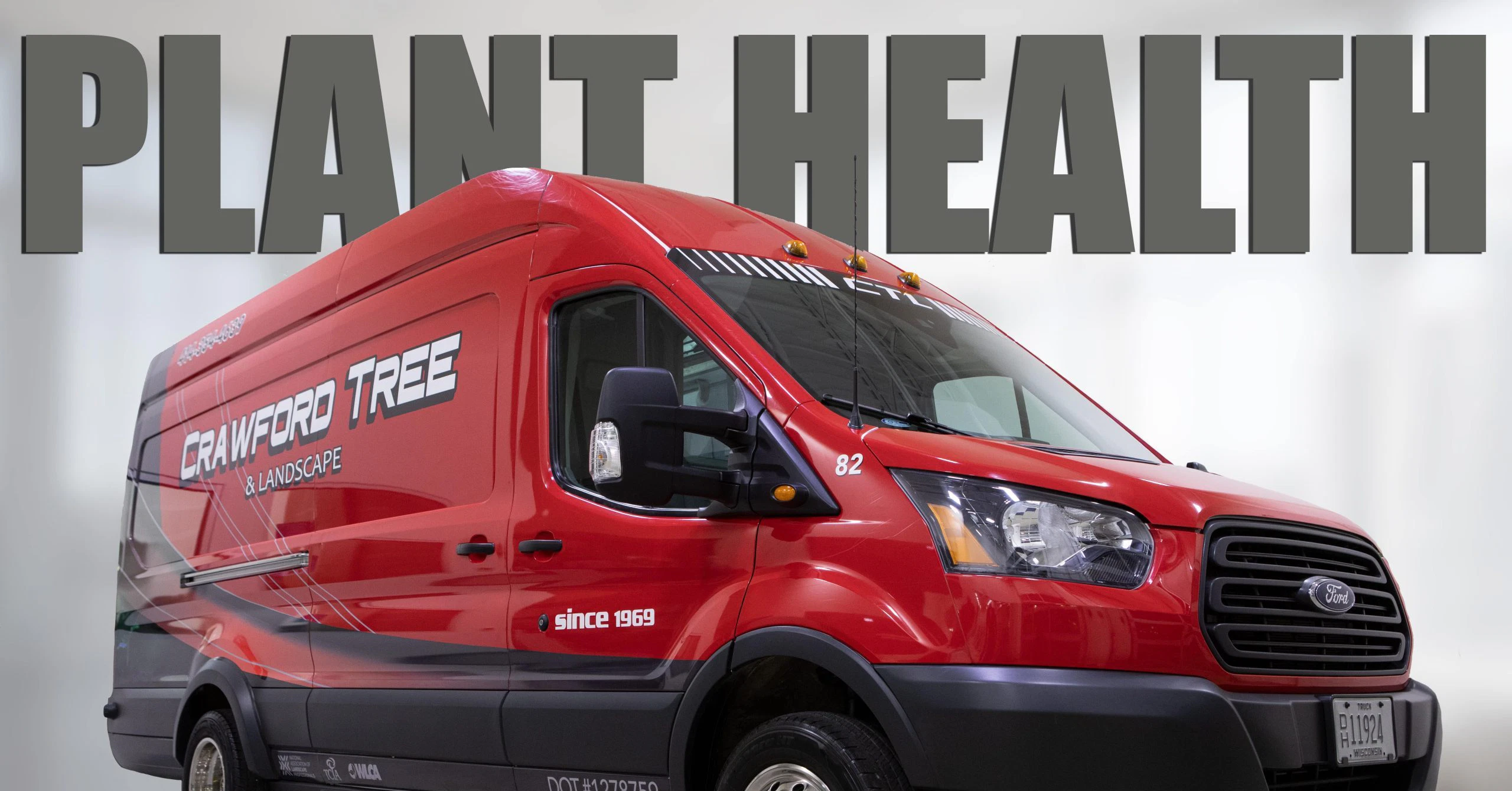 Arborist applying fall fertilizer to tree roots in Greater Milwaukee, WI