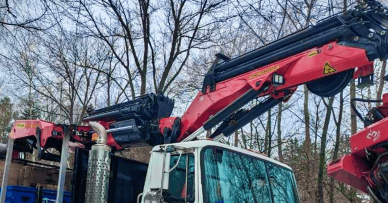Crawford Tree & Landscape crew removing a hazardous overgrown pear tree from a Milwaukee property.