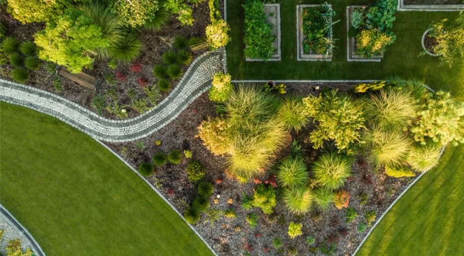 NALP Certified Landscaper designing a sustainable garden bed in Southeast Wisconsin.